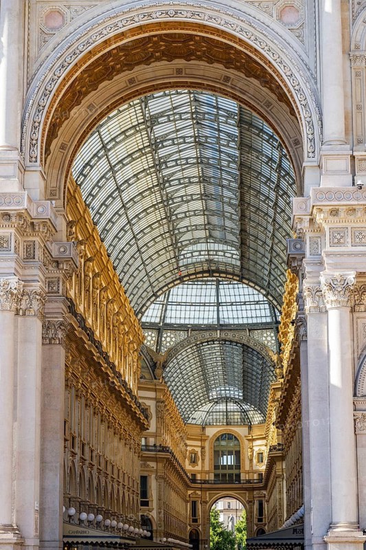 View of the Galleria Vittorio Emanuele with its many luxury shops in Milan on a sunny day, Milan, Italy