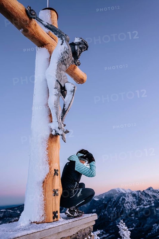 Summit bliss in the snow-covered winter landscape in the Tannheimer Tal in the Alps on the Neunerköpfle, Tyrol, Austria