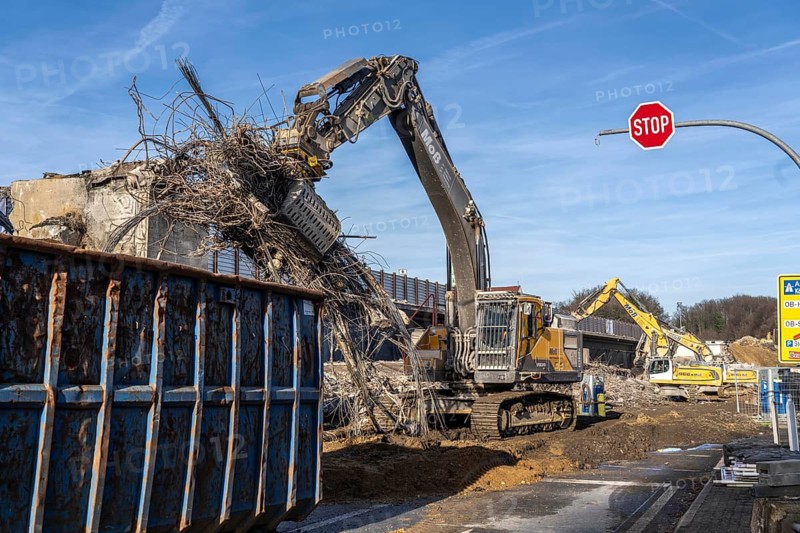 Demolition of the 120 meter long motorway bridge of the A516, across Teutoburger Straße in Oberhausen-Sterkrade, the bridge, built in 1970 was severely damaged, traffic continues to roll on the still existing West Bridge, after the demolition, the eastern part is rebuilt using a process unique in the world, 40 meter long precast concrete beams are assembled one after the other, reducing the construction period from 24 to 7 months after the completion of this bridge Will the western part also be rebuilt, North Rhine-Westphalia, Germany