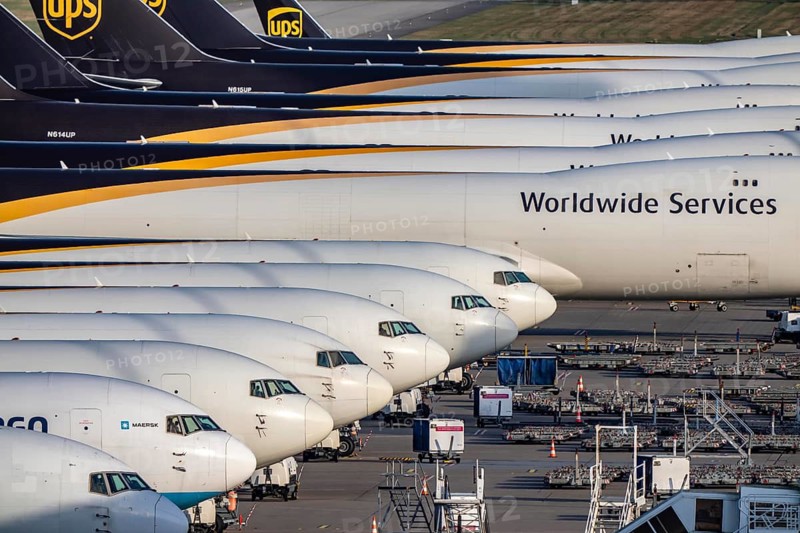 Cologne-Bonn airport, CGN, air freight center, UPS logisic hub, UPS cargo aircraft on the apron, at the logistics center, Boeing 747 freighter in the back