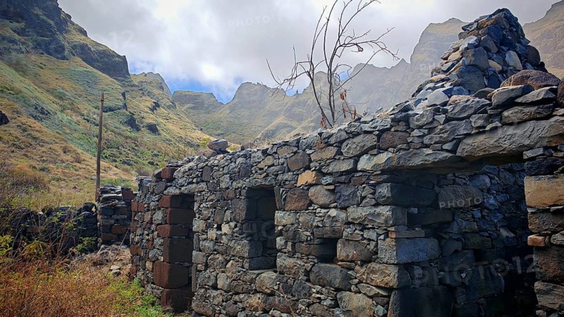 Ruined volcanic stone house in a mountainous landscape under cloudy sky, hiking, lost place, abandoned village of Formiguinhas, Marinha da Cruzinha Natural Park, Santo Antao, Cabo Verde, Cape Verde, Cape Verde