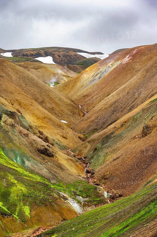 Small river between colourful rhyolite mountains, volcanic landscape, erosion landscape, Landmannalaugar, Fjallabak Nature Reserve, Icelandic Highlands, Suðurland, Iceland