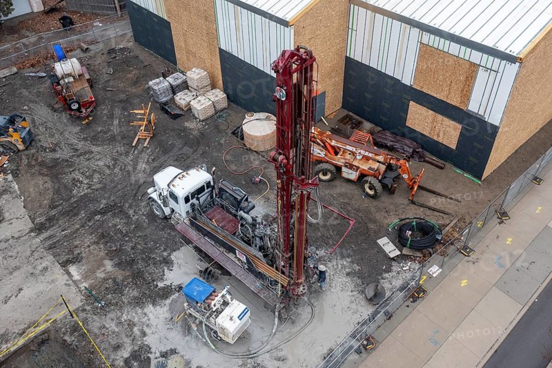 Detroit, Michigan - Workers for Crabtree Drilling drill a series of 500-foot deep wells for a geothermal system. The system will heat and cool a new commercial building housing a public market at the East Warren Development Corporation