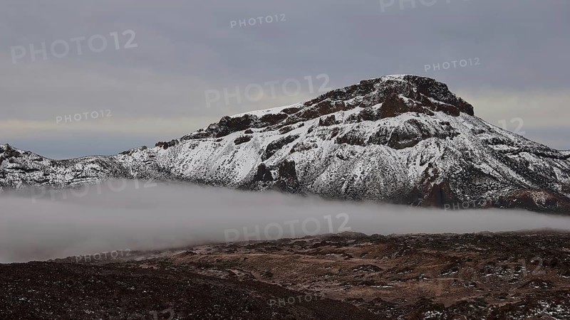 Caldera, snow-covered mountain range with fog and cloudy sky, Teide, Parque Nacional del Teide, Teide National Park, volcano, volcanism, UNESCO World Heritage Site, Tenerife, Canary Islands, Spain
