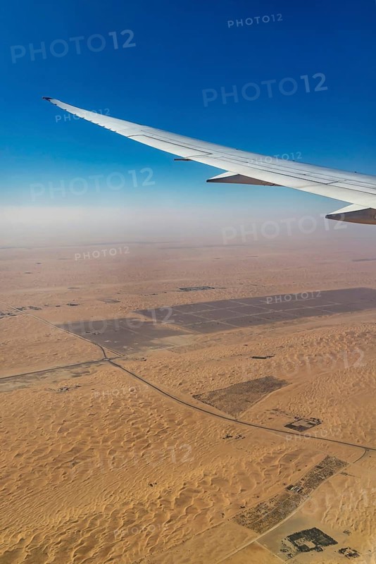 Landing approach over the desert to Abu Dhabi with the airline Etihad. View from the window of a Boeing 787 aircraft. Abu Dhabi, United Arab Emirates, UAE, Southwest Asia