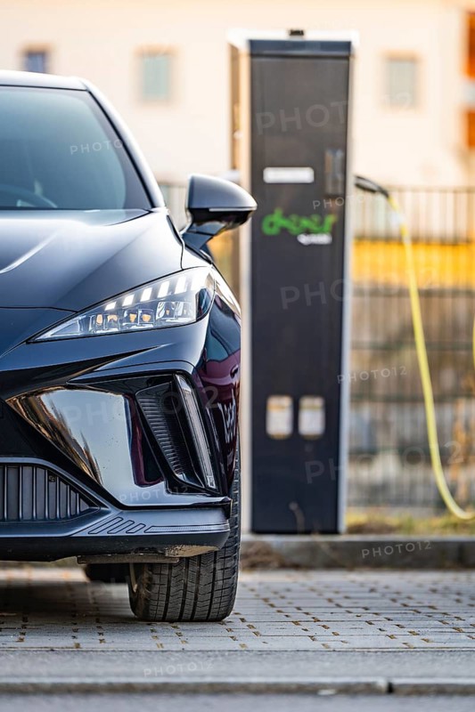 Front view of a black electric car next to a charging station, Deer E- Carsharing vehicle MG4, district of Calw, Germany