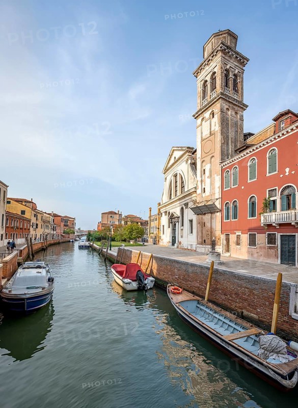Colourful house facades and church on a canal, Venice, Veneto, Italy