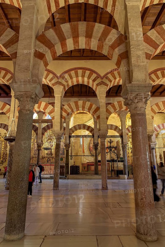 Series of decorative arches and massive columns in the Cathedral Mosque of Córdoba (Mezquita-Catedral), Cordoba, Andalusia, Spain