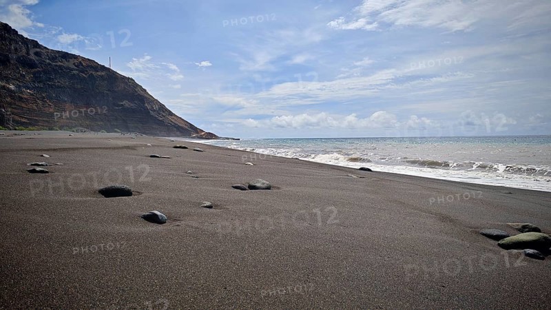 A secluded black sandy beach, volcanic sand with scattered stones under a wide sky, hiking, Tarrafal de Monte Trigo, Santo Antao, Cabo Verde, Cape Verde, Cape Verde
