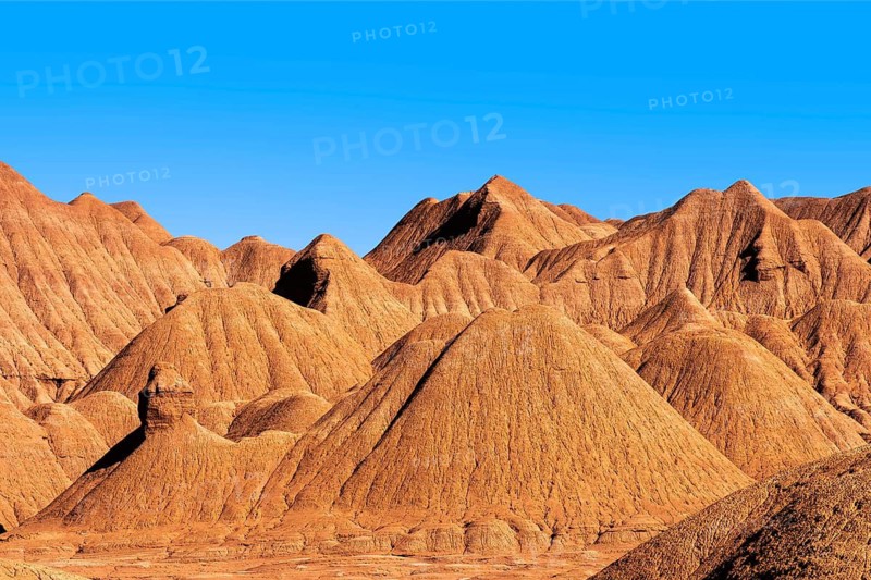 Stark and beautiful ridges of Devil's Desert, showcasing the rugged terrain and rich, earthy colors under a clear blue sky in Salta, Argentina