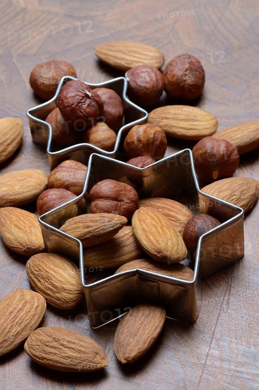 Nuts and cookie cutters, almonds and hazelnuts