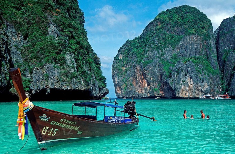 People, longtail boats on Maya Bay beach, known from the movie The Beach, one year in front of the tsunami, Ko Phi Phi Le, Thailand, December 2002, vintage, retro, old, historic