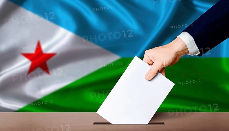 Hand placing a ballot in ballot box with the Djiboutian flag in the background. Djibouti Presidential vote 2026