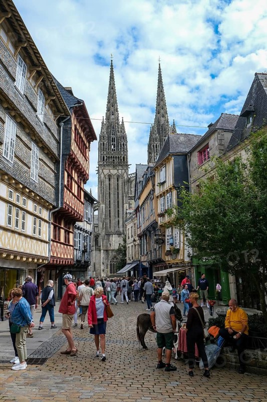 Quimper, Brittany, France - Quimper, Kemper in Breton, is the capital of the historic Cornouaille region in Brittany and the seat of the prefecture of the Département Finistère. Old town with half-timbered houses and the Saint-Corentin cathedral at the back