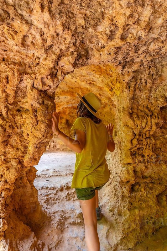 A woman exploring a cave in the Monasterio de Piedra Natural Park, Aragon