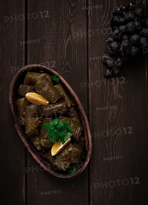 Dolma (Tolma) stuffed rolls, minced meat with rice, in grape leaves, top view, no people, close-up