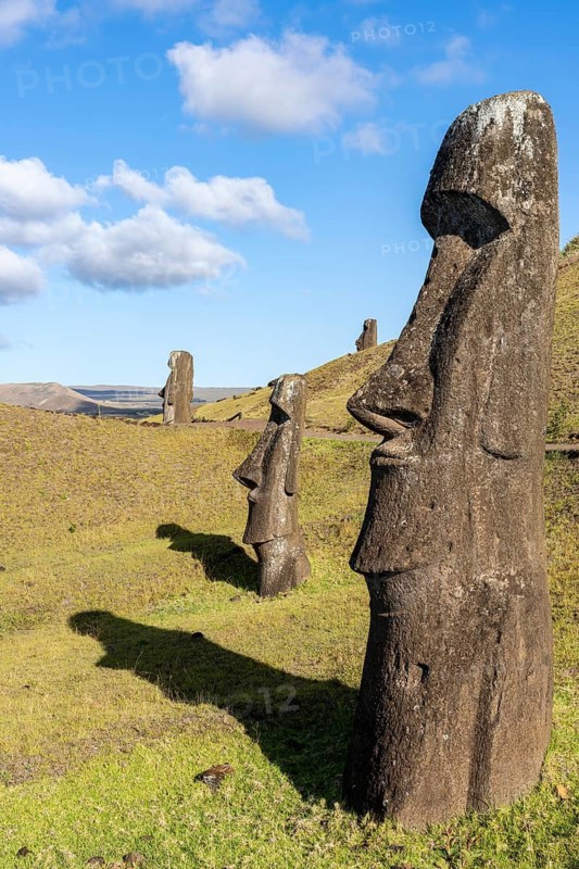 Moai stone sculptures standing in row on the slope of the volcano, Rano Raraku Quarry, Rapa Nui National Park, Easter Island, Chile