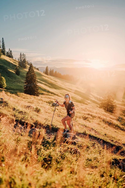 Summer trail running and hiking in the Alps on the Riedberg Pass between Obermaiselstein and Balderschwang in the Allgäu, Bavaria, Germany