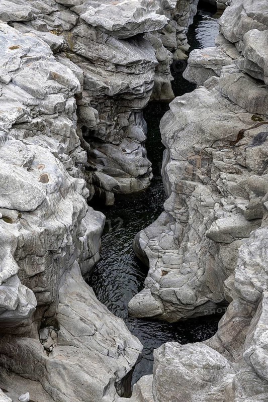 Rocks, granite rock formations in the Maggia River near Ponte Brolla, in the Maggia Valley, Valle Maggia, Canton Ticino, Switzerland