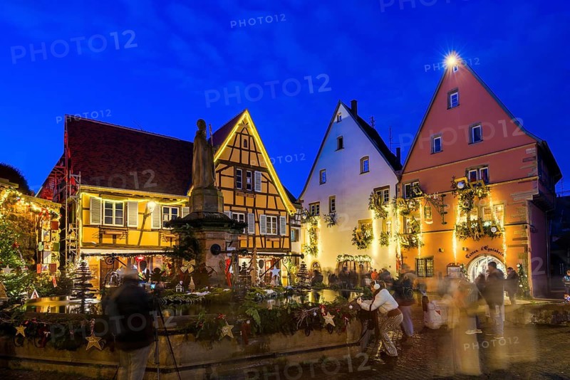 Houses illuminated and decorated for Christmas, Christmas market, blue hour, Eguisheim, Haut-Rhin department, Grand Est region, Alsace, France