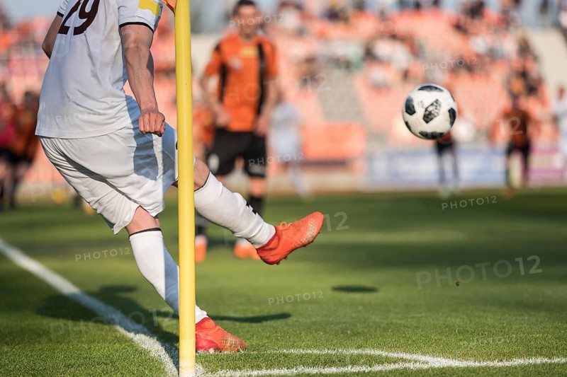 Player takes the corner during professional football match.