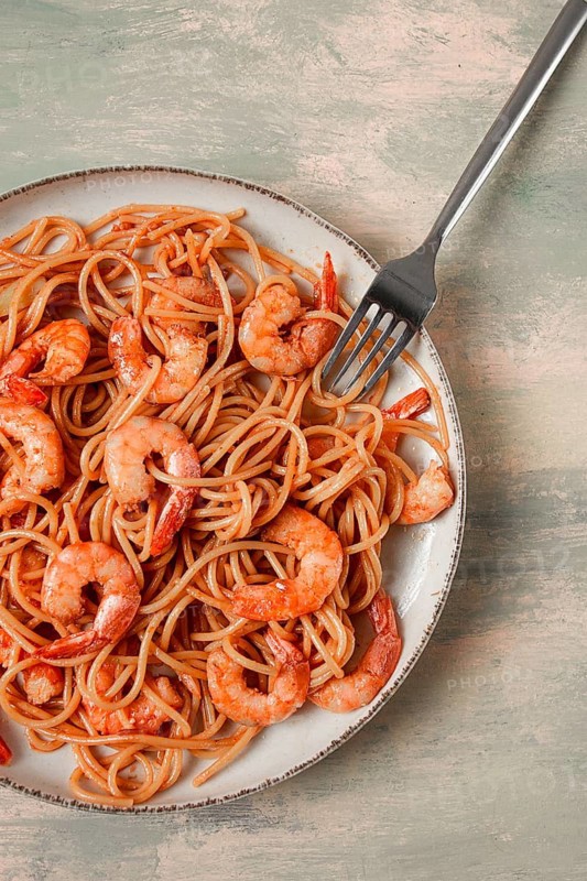 Spaghetti with king shrimps, with spices, top view, selective focus, homemade, no people