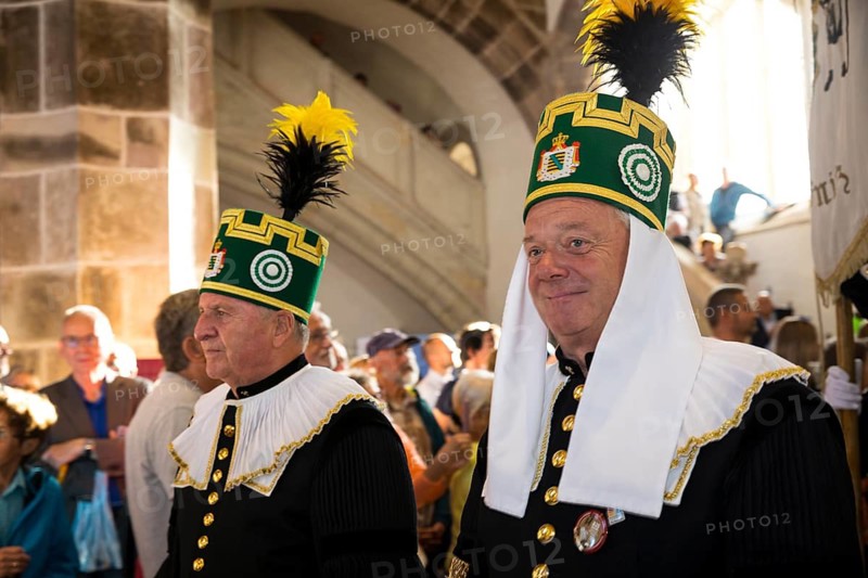 Historic mining day of miners 2025 in Schneeberg, miners of all trades proudly wear their habit on this traditional day, Great mountain parade moving into the church of St. Wolfgang in Schneeberg, Ore Mountains, Saxony, Germany