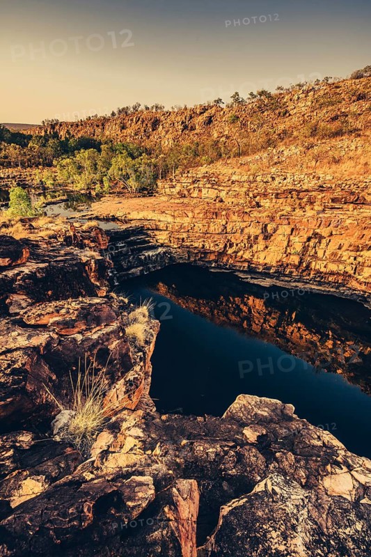Bell Gorge waterfall, a body of water in north-west Australia in the Kimberley. Sunrise in the outback, Australia