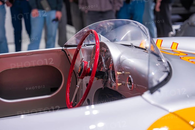 Close-up view of a vintage silver convertible car with red steering wheel, Porsche Museum, Stuttgart, Germany