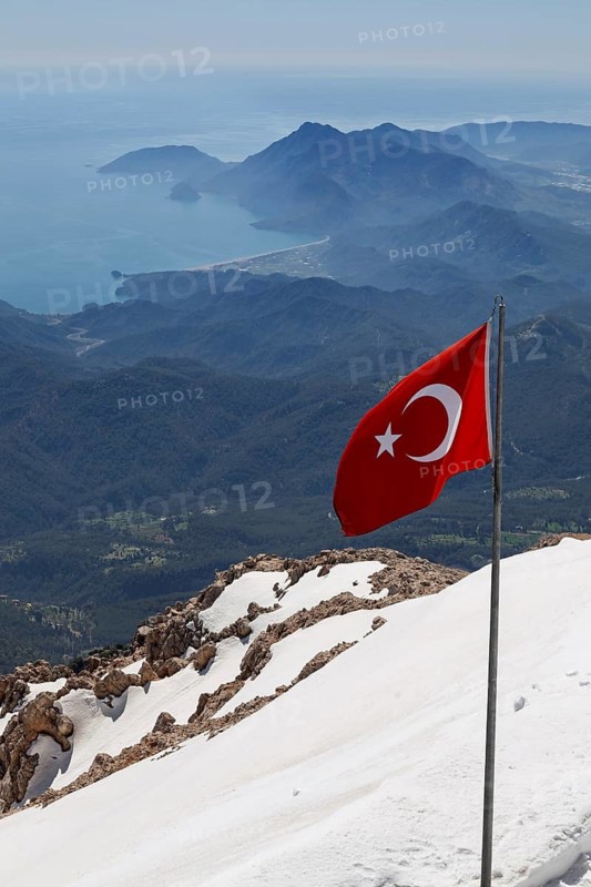 National flag on the mountain Tahtali Dagi, Turkey