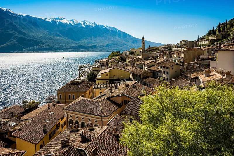 Picturesque village and colorful houses on the lake and steep mountains, Limone sul Garda, Lake Garda, Brescia province, Lombardy region, Italy