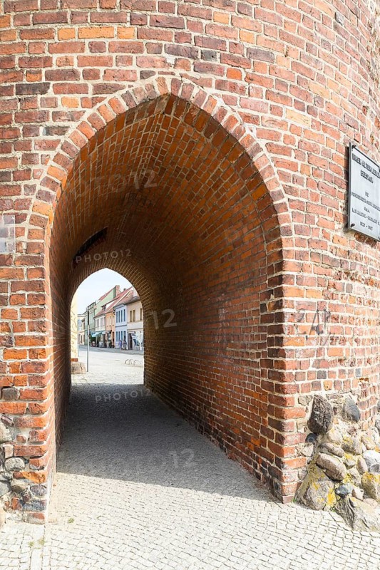 Passage to the town centre through the Luckauer Torturm or Dicker Turm as a medieval part of the town fortifications around Beeskow, Brandenburg, Germany