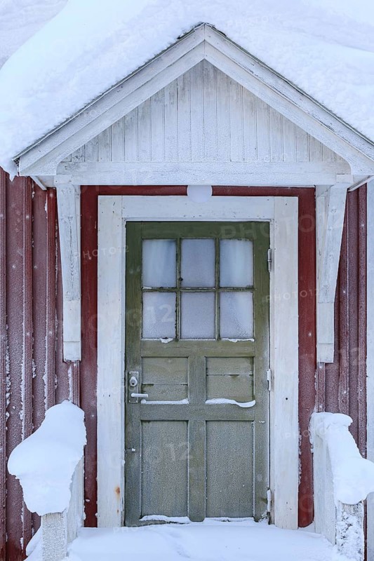 Snow-covered door, wooden house, red, cold, snow, winter, near Gällivare, Lapland, Sweden