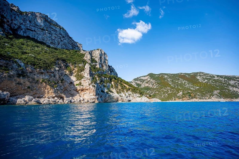 Picturesque rocky coast, cliffs and blue sea, Golfo di Orosei, Baunei, Sardinia, Italy