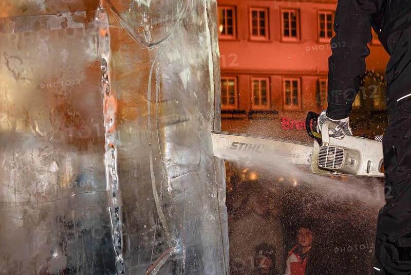 An ice sculpture is being created: ice carving street action as part of the long shopping night in the city center of Reutlingen, Baden-Württemberg, Germany, for editorial use only