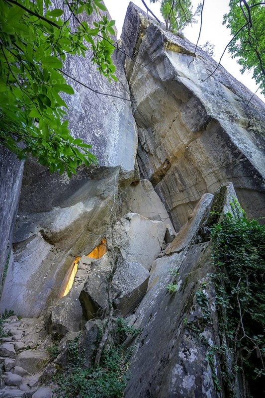 Incidental sun illuminates the passage (Chambre du Roi) through the high rocks, hike through the sandstone labyrinth Grés d'Annot, Alpes-de-Haute-Provence, France