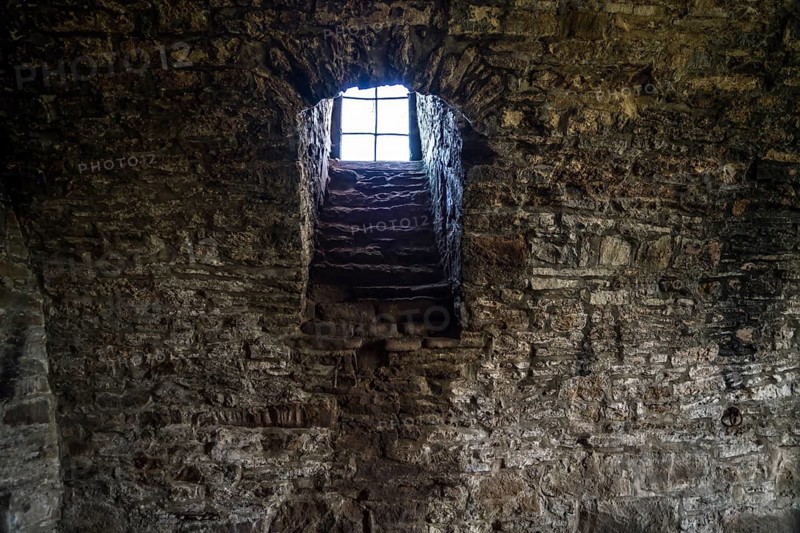 A barred window in a cellar, Wülmersen moated castle, Hesse, Germany