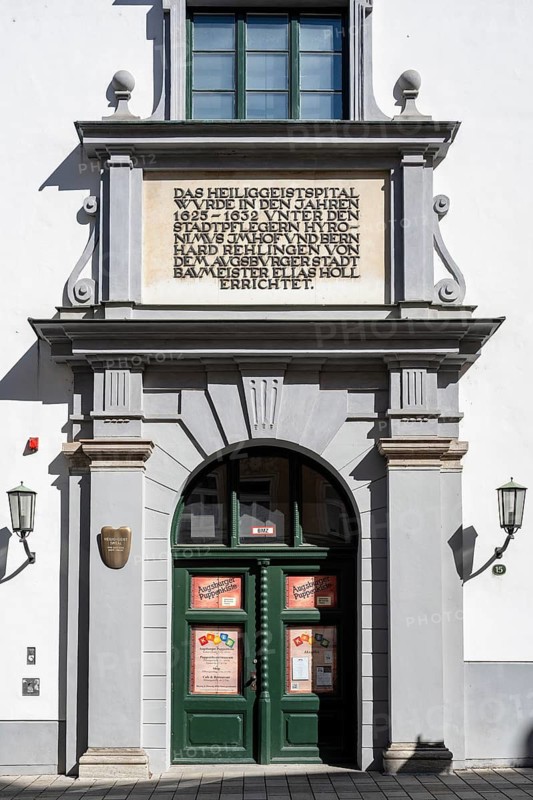 The Holy Spirit Hospital with the entrance to the world-famous Augsburg doll box, puppet theater and puppet theater museum in the old town of Augsburg, Swabia, Bavaria, Germany