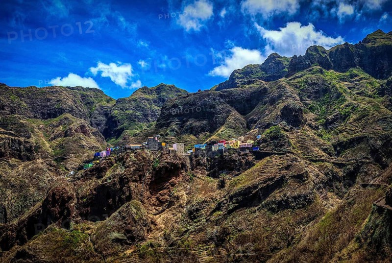 Panoramic view, small settlement, colorful village, picturesque nestled in raw, dramatic mountains under blue skies, spectacular hiking, natural heritage, cultural heritage, terraces in Fontainhas, Santo Antao, Cabo Verde, Cape Verde, Cape Verde, Cape Verde