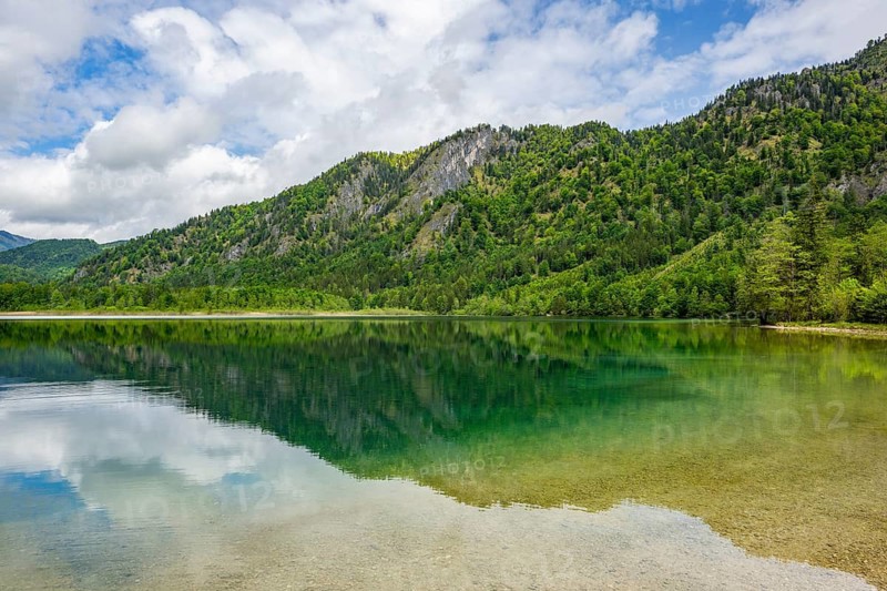 Landscape of Lake Offensee after rain when the sun comes through the clouds in spring, Salzkammergut, Austria