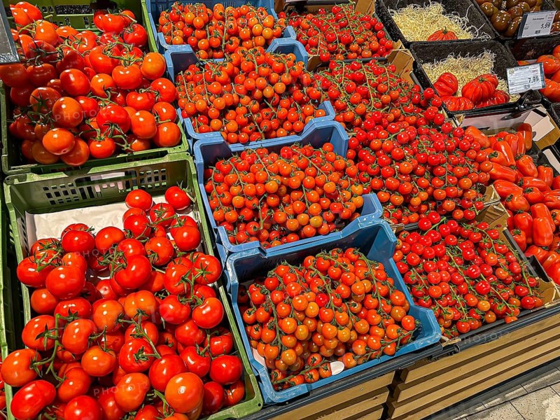 Fruit rack in a supermarket. Tomatoes in various varieties. diversity. Stuttgart, Baden-Württemberg, Germany