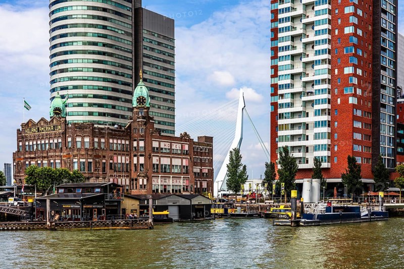 Hotel New York, historic art nouveau building on the Kop van Zuid, former headquarters of the Holland America Line, thousands of emigrants once left this place for North America, modern architecture in the city panorama, Rotterdam, Netherlands