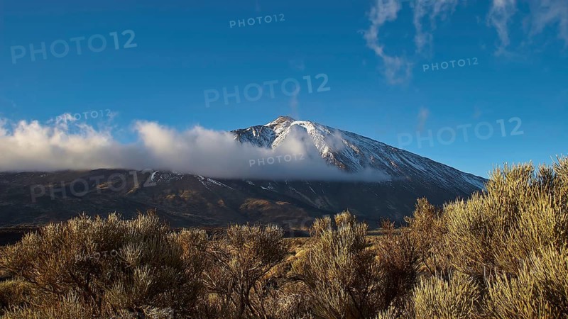Impressive snow-covered mountain with clouds and clear sky in the background, Teide, Parque Nacional del Teide, Teide National Park, volcano, volcanism, UNESCO World Heritage Site, Tenerife, Canary Islands, Spain