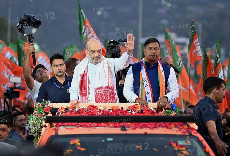 Amit Shah greets supporters during a road show of the Bharatiya Janata Party ahead of the Assam Assembly Election 2026 in Guwahati, India on 28 March 2026