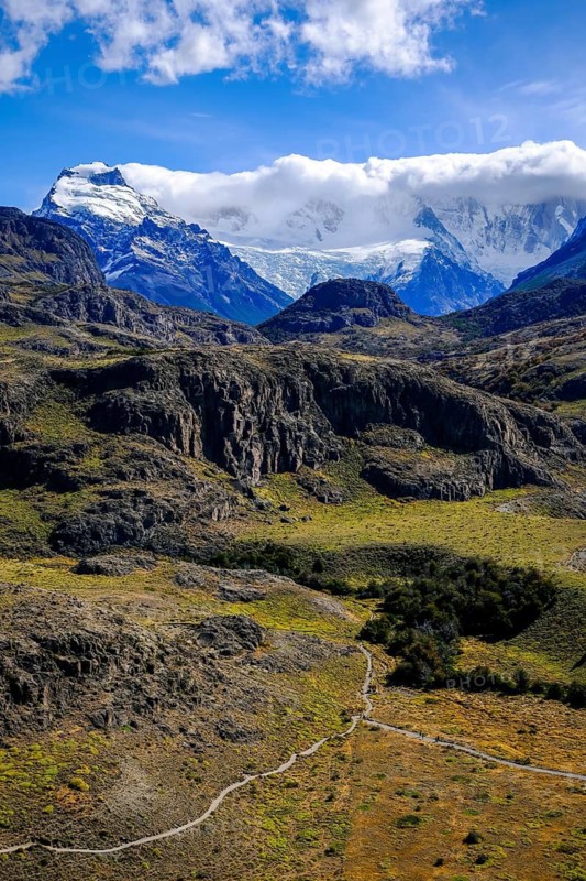 El Chaltén, Patagonia, Argentina, El Chaltén with a view of the Fitz Roy massif. El Chaltén offers the most direct access to the mountain massifs of Cerro Torre and Fitz Roy. The trekking resort is located 222 kilometres north of El Calafate, on the border with Chile