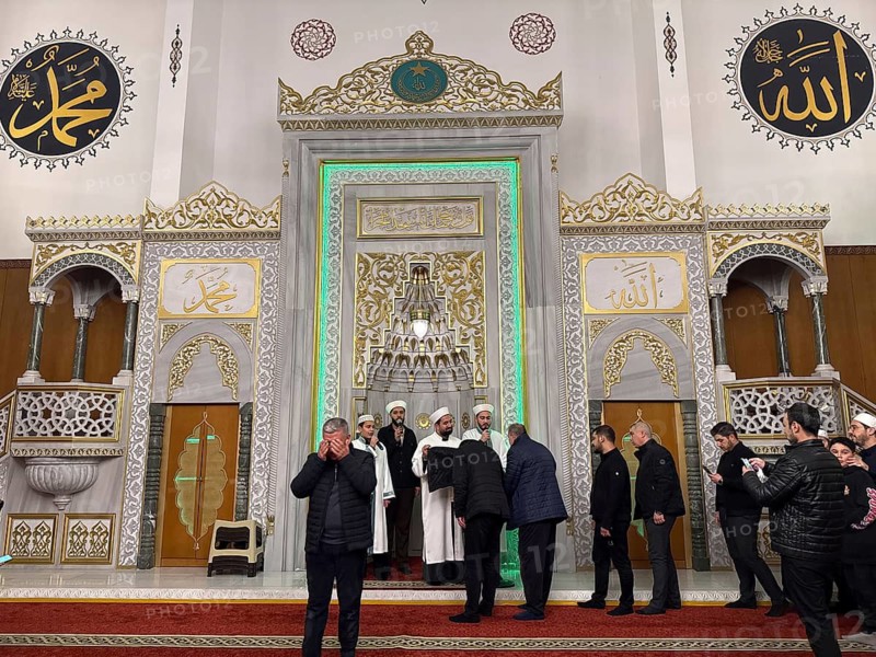 Dozens of Muslims stand in a long queue to view a sacred piece of the Kaaba curtain (Kiswa) while observing Laylat al-Qadr with prayers and supplications during the holy month of Ramadan in Gaziantep, Turkey on March 16, 2026, Gaziantep, Turkey