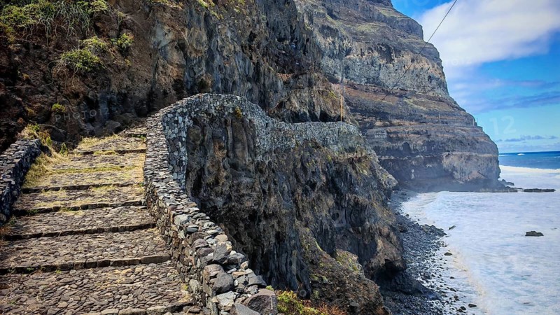 Narrow stone trail, volcanic stone hiking trail along high cliffs with sea views, hiking, Marinha da Cruzinha Natural Park, Santo Antao, Cabo Verde, Cape Verde, Cape Verde