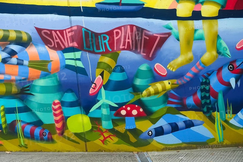Graffiti, spray art, colorful pictures, public art, mythical creatures, fantastic creatures, human and animal beings, feet, fish, marine animals, artistically designed entrance to the underground car park, concrete wall, Orschel-Hagen, district of Reutlingen, Baden-Württemberg, Germany