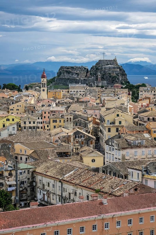 Corfu Town, Corfu, Greece, City overview Corfu Town with the Greek Orthodox Church of Agios Spiridon and the New Fortress. Back mainland Albania