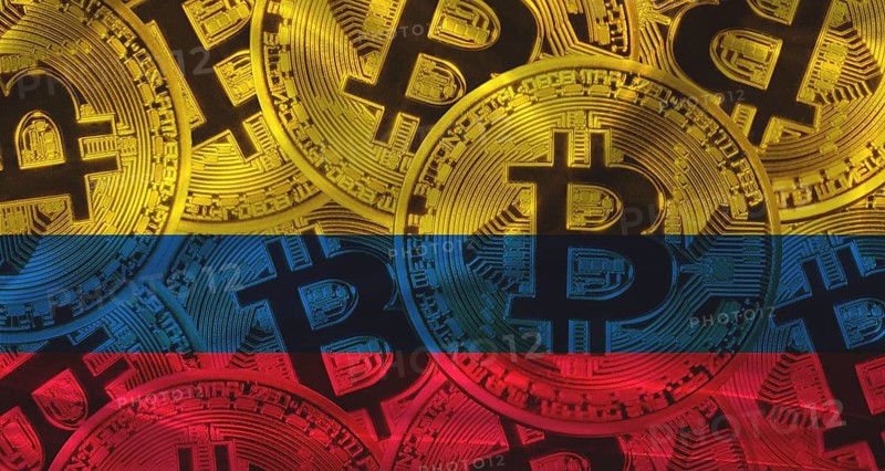 Golden bitcoin coins on Colombia flag background. Bitcoin coins on Colombia flag background